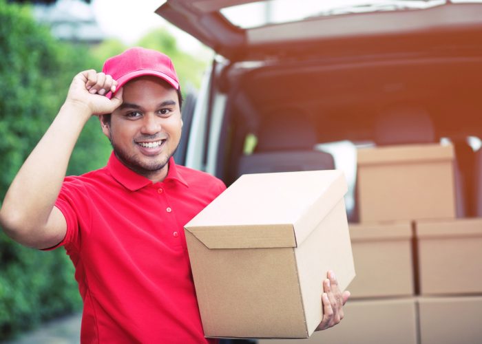 parcel-delivery-man-package-through-service-send-home-consign-hand